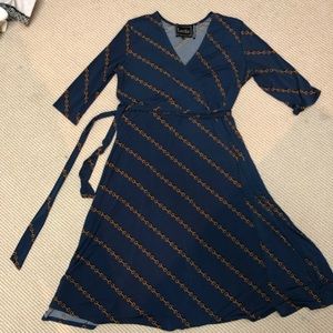 Patterned blue and gold wrap dress